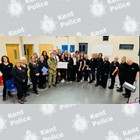 The presentation of the cheque to representatives from the choir.