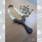 Photo of catapult and stones on a desk