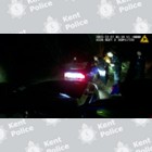 A still image of a car crashed into a tree