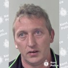 White clean shaven man in his 30s with short fair hair.