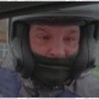 Photo of a man wearing a bike helmet