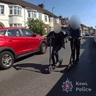 Two men on electric scooters