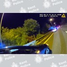 Two cars pulled over at the side of a road