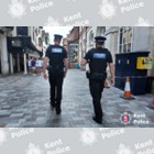 Two officers in uniform and on foot.