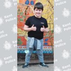 A white teenage boy with brown hair and wearing tracksuit bottoms and a T-shirt