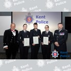 Three PCs receiving awards.