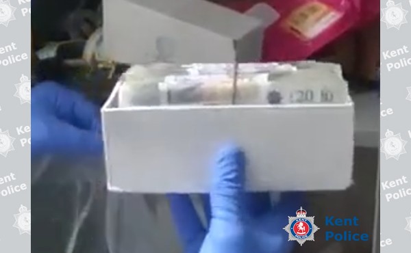 Some of the cash located during the property search.