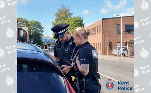 Officers checking car occupants LATEST