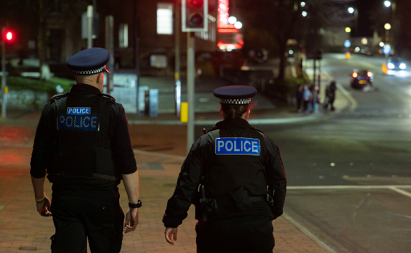 Officers on patrol at night.