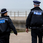 Police officers on patrol on the coast